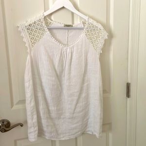 Adorable white linen sleeveless top with lace accents on shoulders and collar.